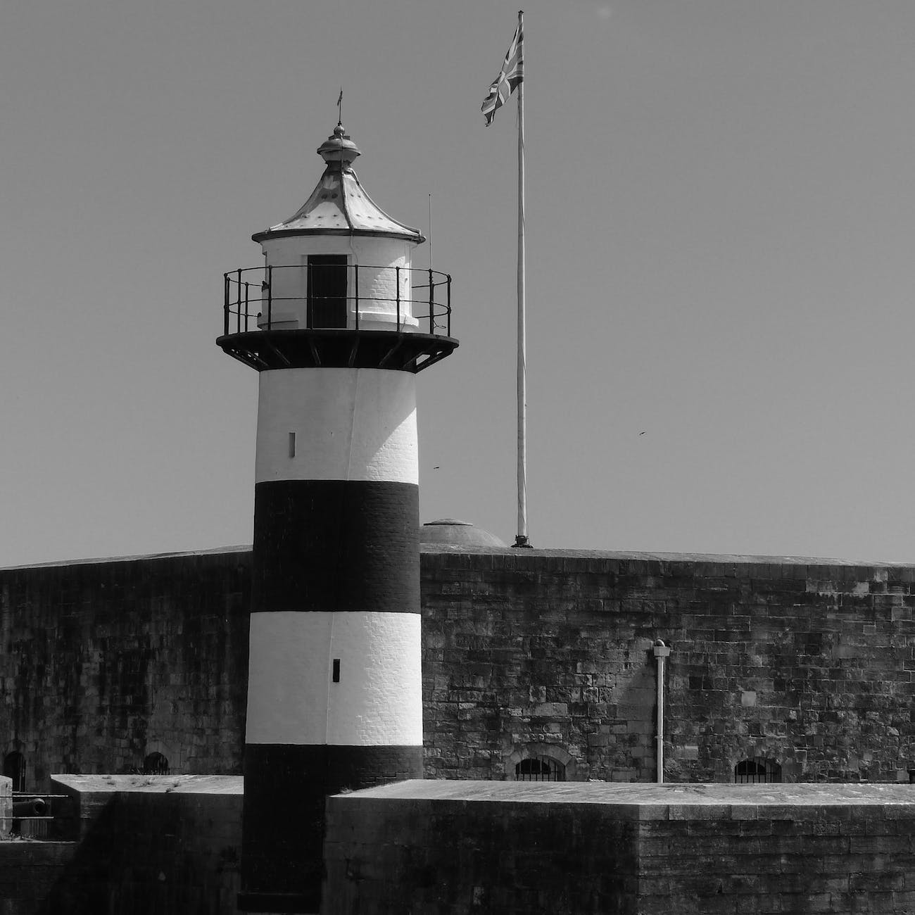 grayscale photo of a lighthouse